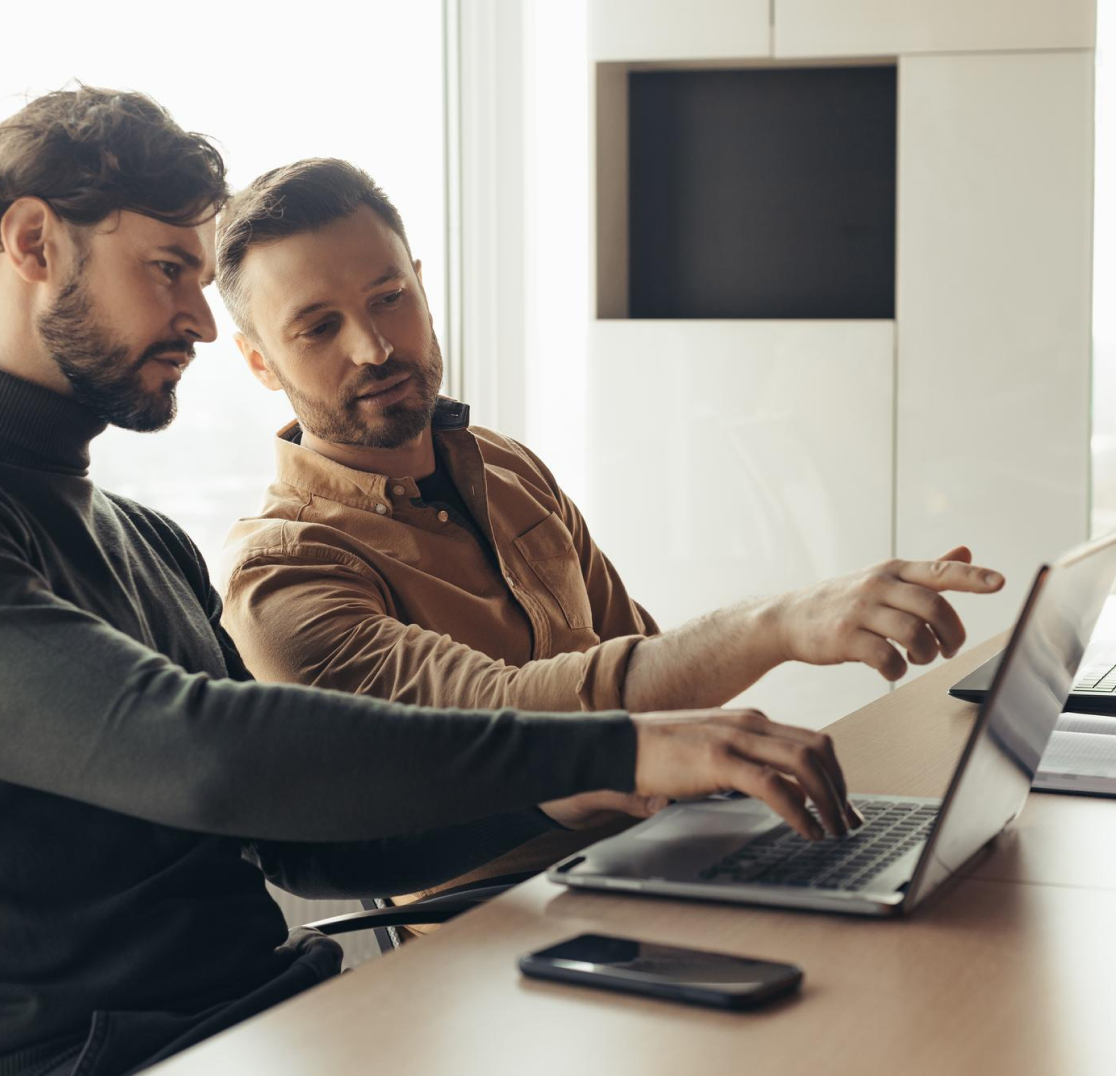 Two startups founders working on their project in front of the computer.